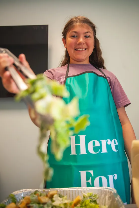 Serving a meal at a Here for Good event